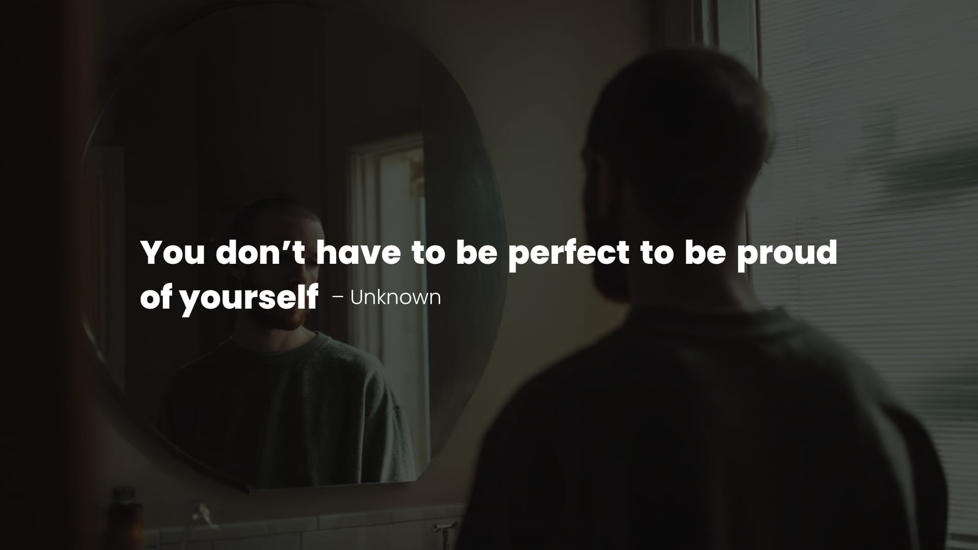 Person looking in a mirror with a quote on anxiety