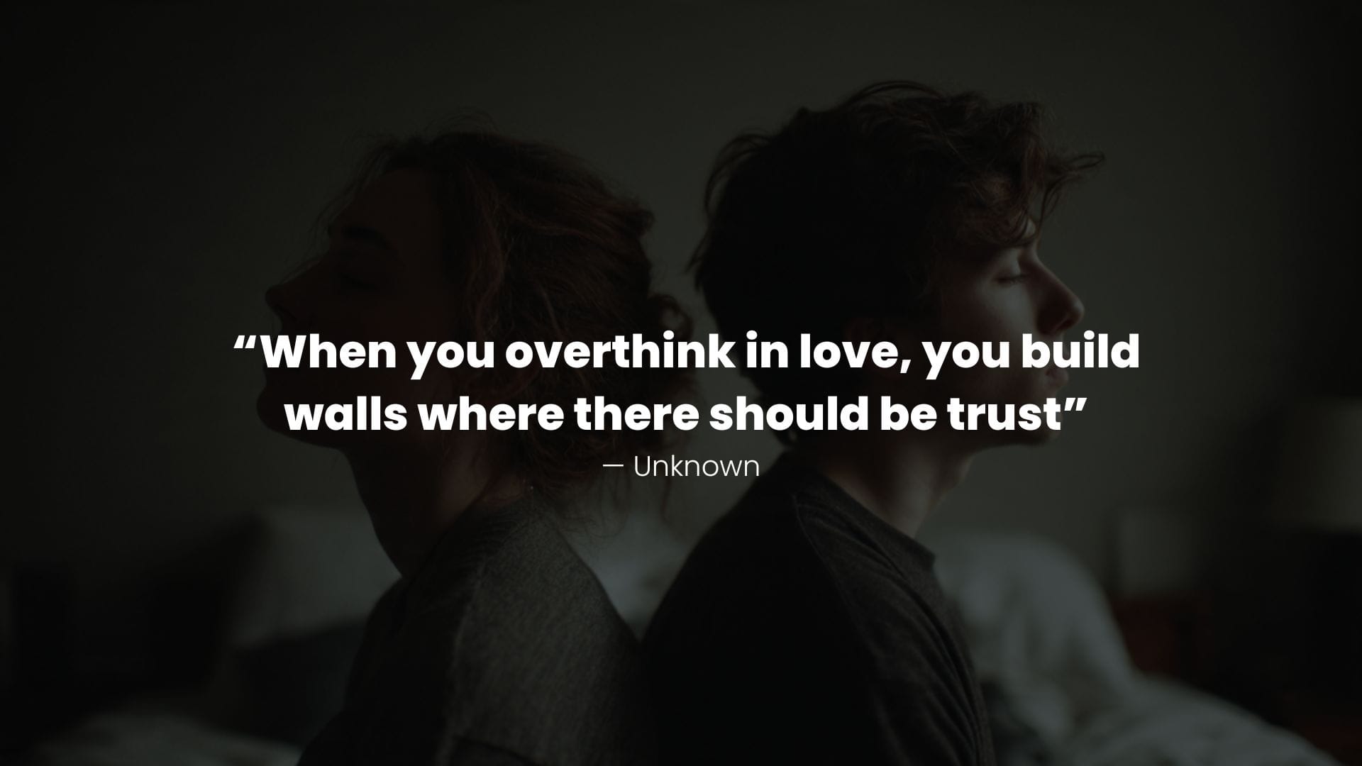 couple sitting back-to-back