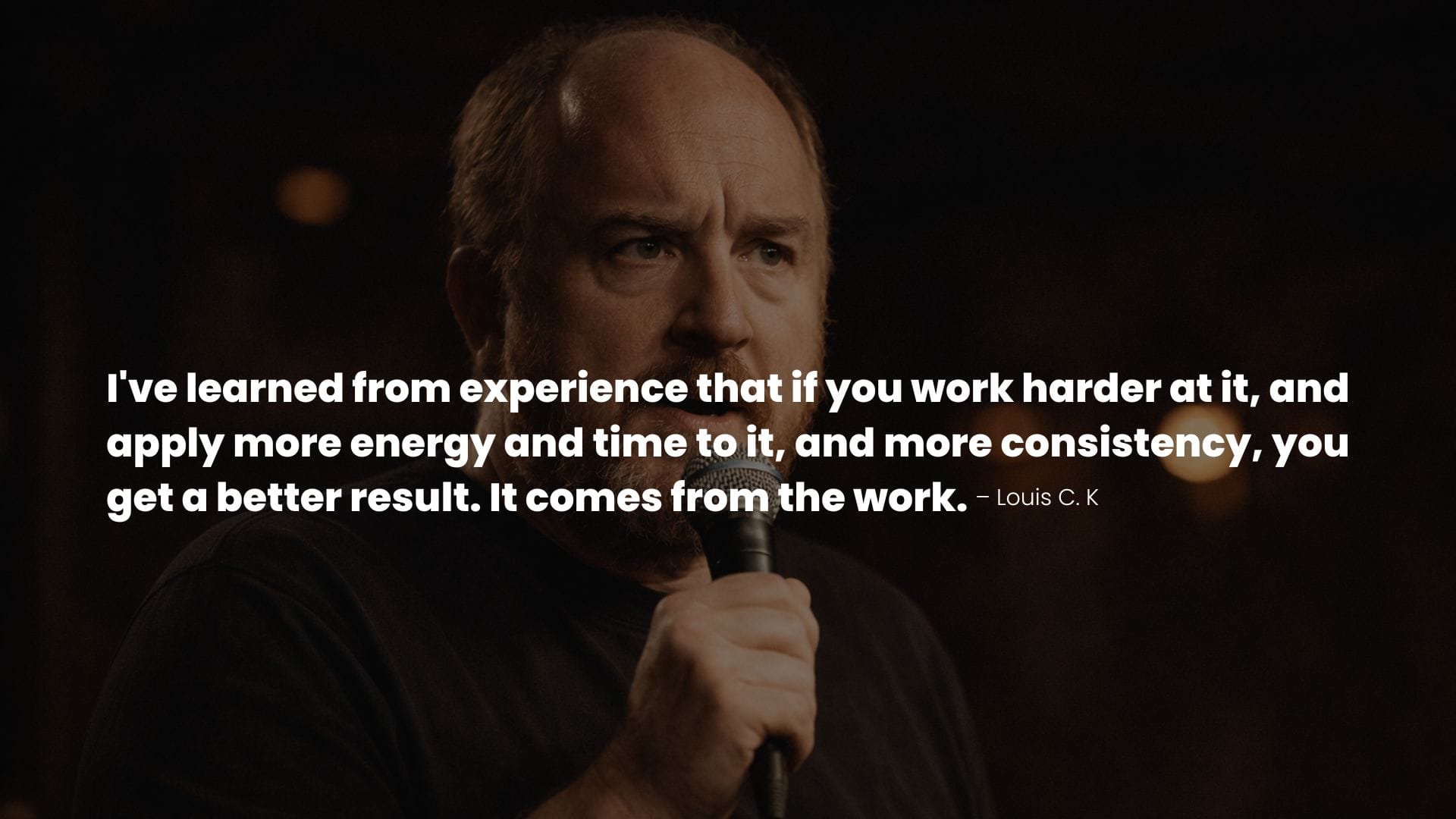 Louis C.K. performing on stage with a quote