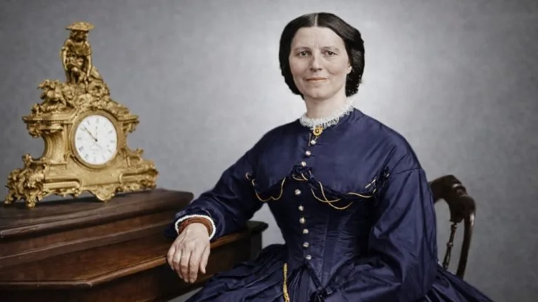 Portrait of Clara Barton in a Victorian dress beside a clock.